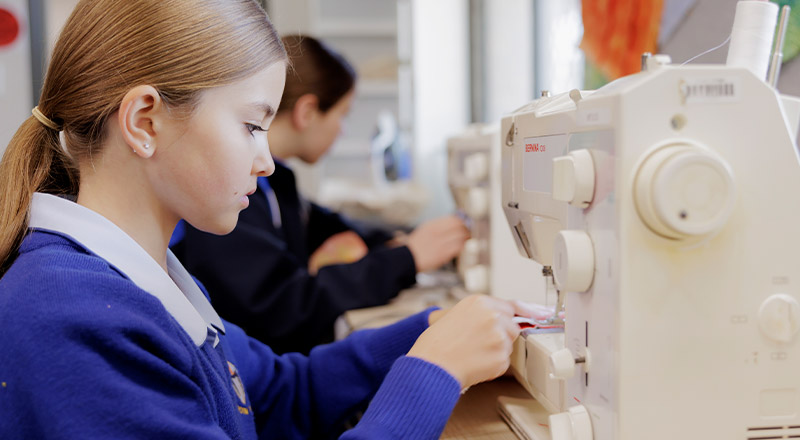 Students using sewing machines at Cerdon College Merrylands