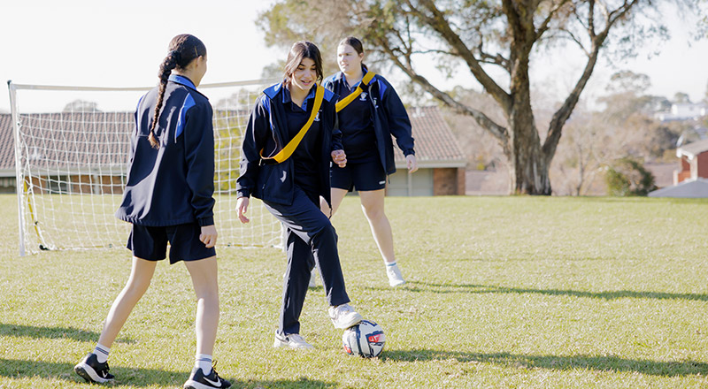 Students playing soccer on Cerdon College Merrylands field