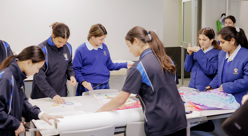 Cerdon Catholic College Merrylands students knitting knee rugs