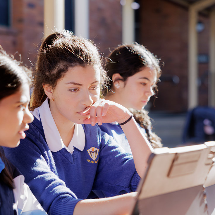 Students using iPad on Cerdon College Merrylands campus