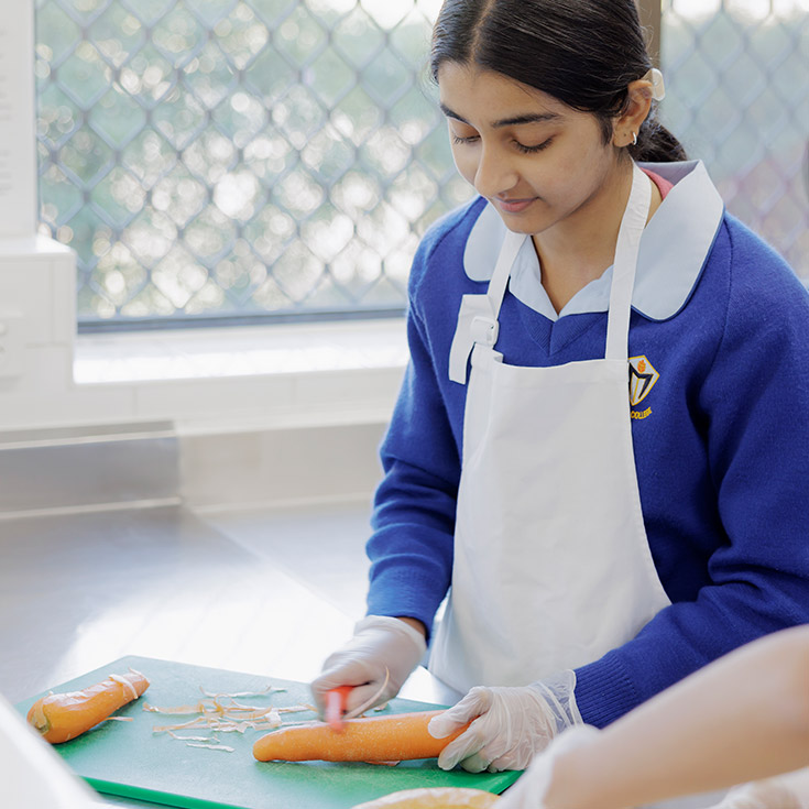 Student inside Cerdon College Merrylands kitchen