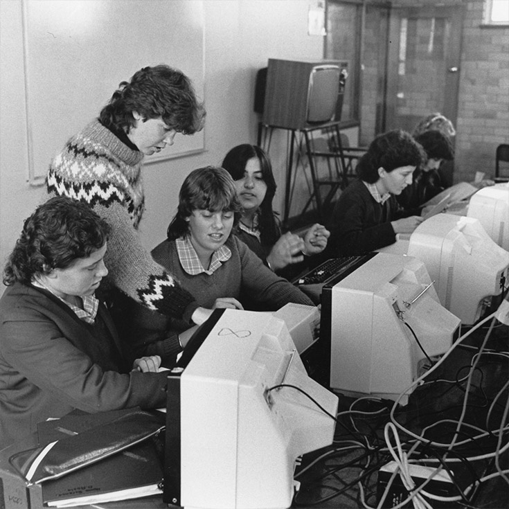 Historical photo go Cerdon College Merrylands students learning to use desktop computers