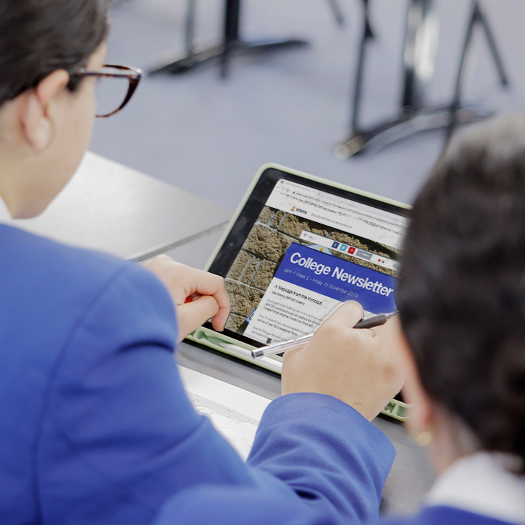 close up shot of Cerdon College Merrylands student reading newsletter
